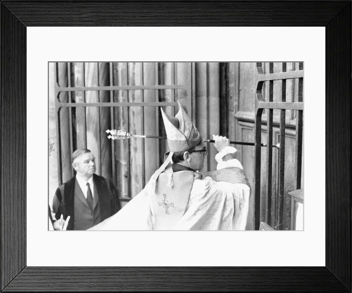 Framed Print : The Rt Revd Dr John Habgood the Bishop of Durham strikes the doors of the Cathedral with Framed Print : The Rt Revd Dr John Habgood the Bishop of Durham strikes the doors of the Cathedral with