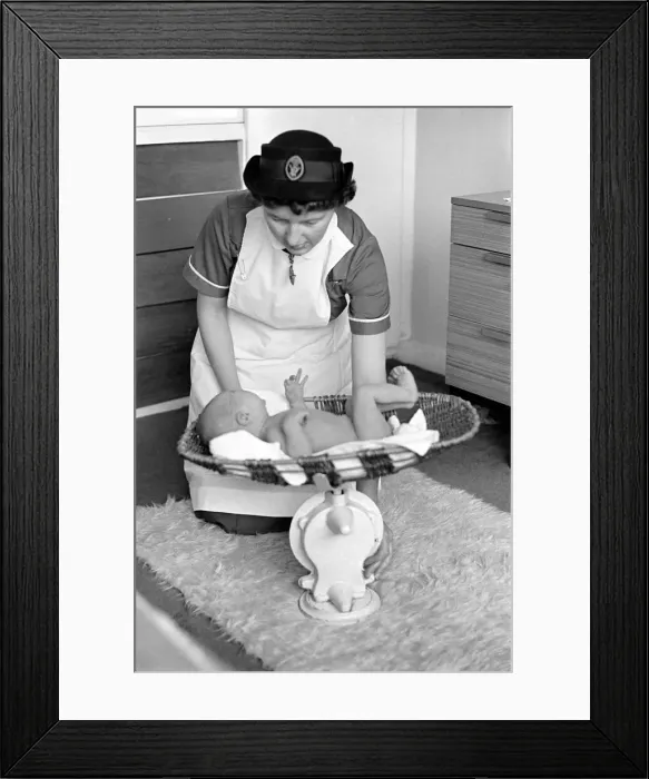 Framed Print : The District Nurse, General scenes of District nurse Muggendge paying a newly born baby a Framed Print : The District Nurse, General scenes of District nurse Muggendge paying a newly born baby a