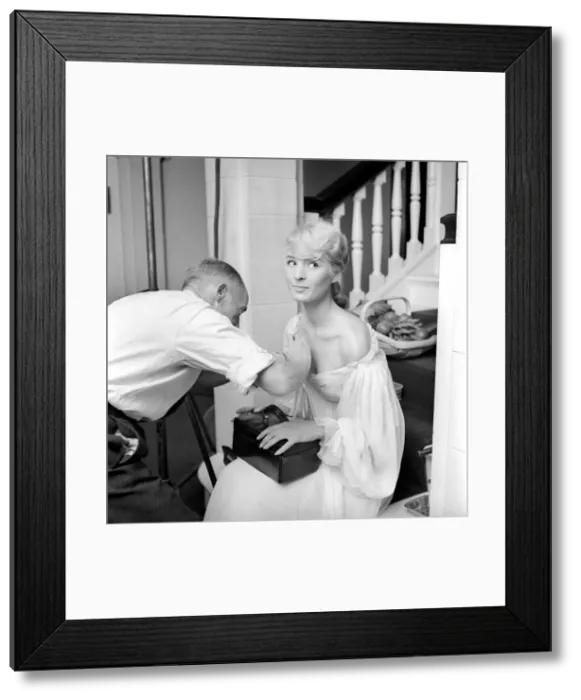 Framed Print : Members of the Wardrobe and make-up departments at Pinewood Studios help the actresses Framed Print : Members of the Wardrobe and make-up departments at Pinewood Studios help the actresses