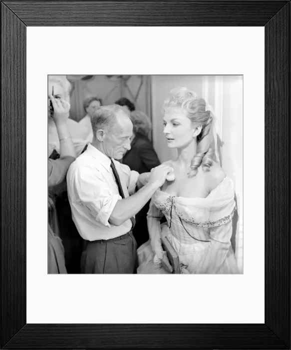 Framed Print : Members of the Wardrobe and make-up departments at Pinewood Studios help the actresses Framed Print : Members of the Wardrobe and make-up departments at Pinewood Studios help the actresses