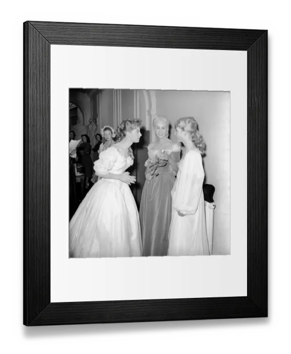 Framed Print : Members of the Wardrobe and make-up departments at Pinewood Studios help the actresses Framed Print : Members of the Wardrobe and make-up departments at Pinewood Studios help the actresses