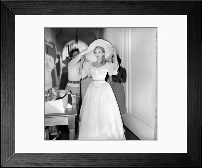 Framed Print : Members of the Wardrobe and make-up departments at Pinewood Studios help the actresses Framed Print : Members of the Wardrobe and make-up departments at Pinewood Studios help the actresses