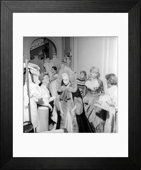 Framed Print : Members of the Wardrobe and make-up departments at Pinewood Studios help the actresses Framed Print : Members of the Wardrobe and make-up departments at Pinewood Studios help the actresses