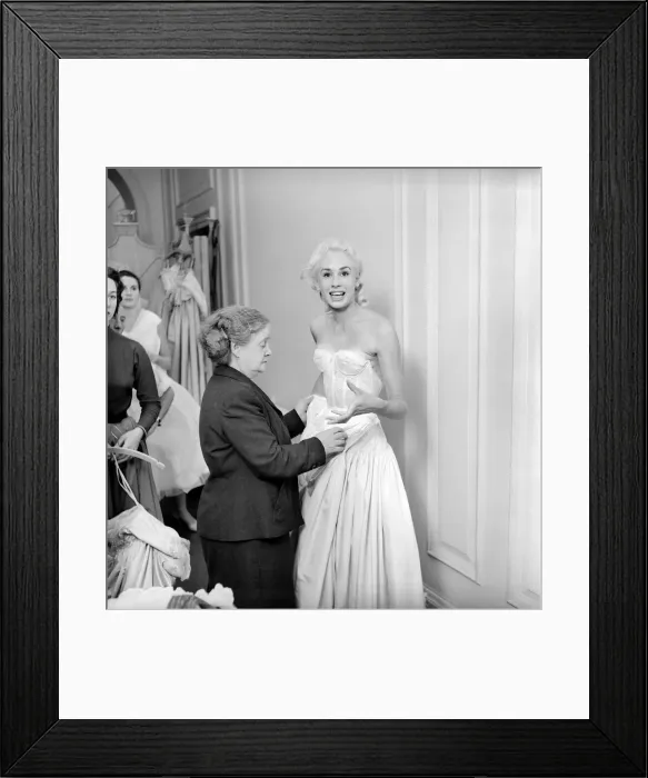 Framed Print : Members of the Wardrobe and make-up departments at Pinewood Studios help the actresses Framed Print : Members of the Wardrobe and make-up departments at Pinewood Studios help the actresses