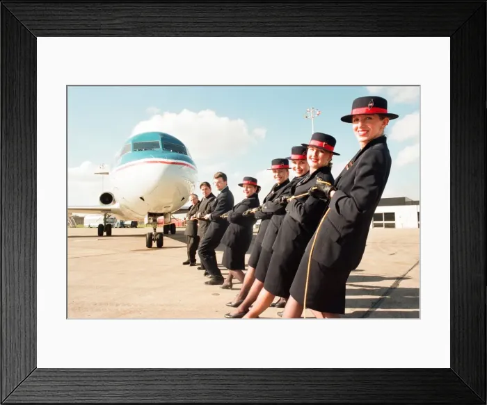 Framed Print : Sponsored aircraft pull at Teesside Airport. British Midland staff practise Framed Print : Sponsored aircraft pull at Teesside Airport. British Midland staff practise