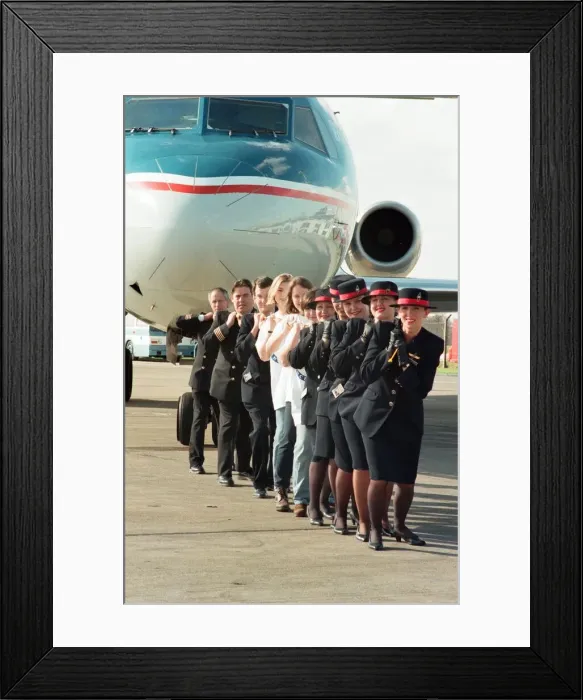 Framed Print : Sponsored aircraft pull at Teesside Airport. British Midland staff are joined by Marie Framed Print : Sponsored aircraft pull at Teesside Airport. British Midland staff are joined by Marie