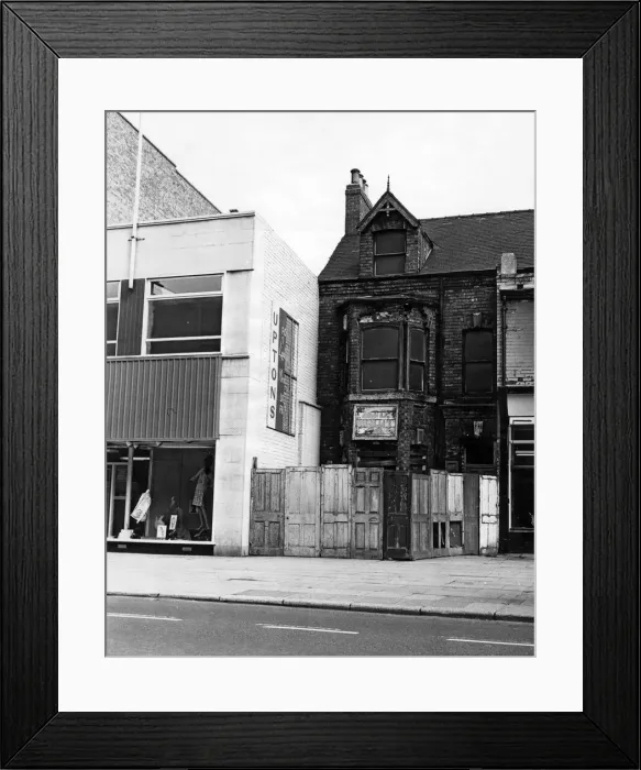 Framed Print : Next to a modern shop front next to a boarded up house, Linthorpe Road. 16th June 1966 Framed Print : Next to a modern shop front next to a boarded up house, Linthorpe Road. 16th June 1966