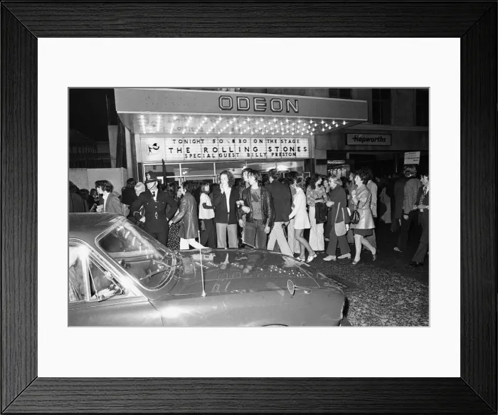 Framed Print : Rolling Stones fans queue outside the Odeon, New Street, Birmingham before the concert Framed Print : Rolling Stones fans queue outside the Odeon, New Street, Birmingham before the concert