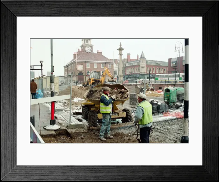 Framed Print : Workmen try to beat the freezing weather, before daytime work on Stockton High Street