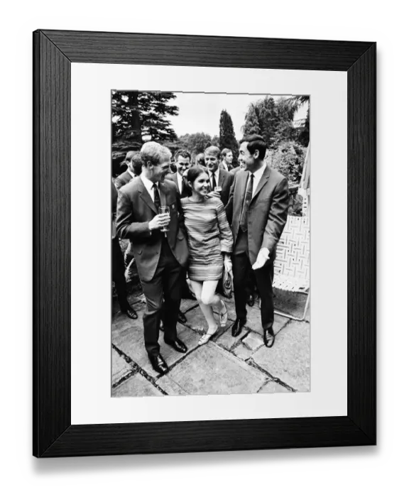 Framed Print : England footballer Gordon Banks reacts after giving a kiss to actress Vivienne Ventura