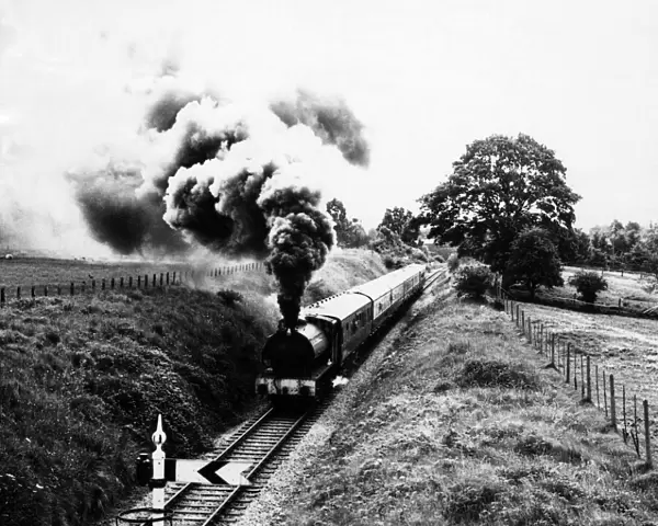 A steam train of the Severn Valley Railway rolls through the Shropshire countryside
