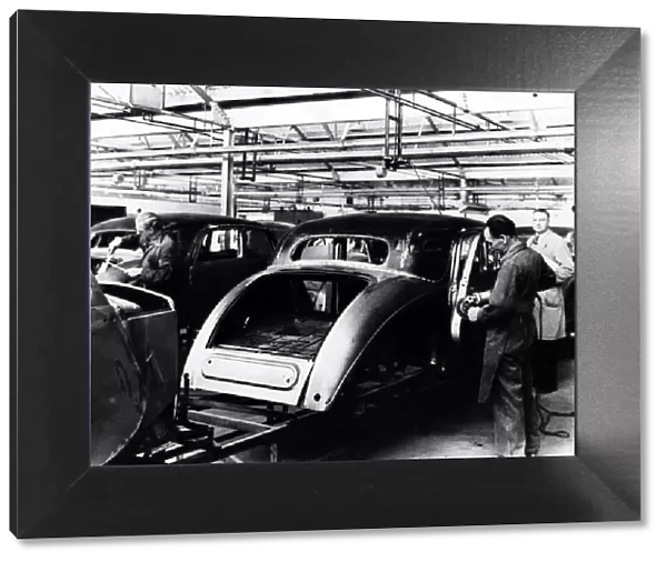 Production of Riley saloons in the late 1940s. Skilled tradesmen are seen fettling
