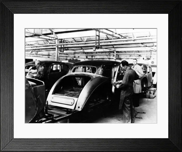 Framed Print : Production of Riley saloons in the late 1940s. Skilled tradesmen are seen fettling