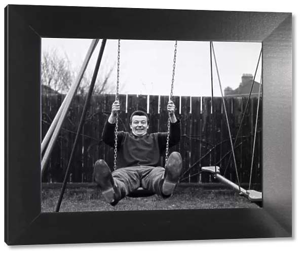 West Ham footballer Johnny Byrne celebrates his England call up with a swing in the back