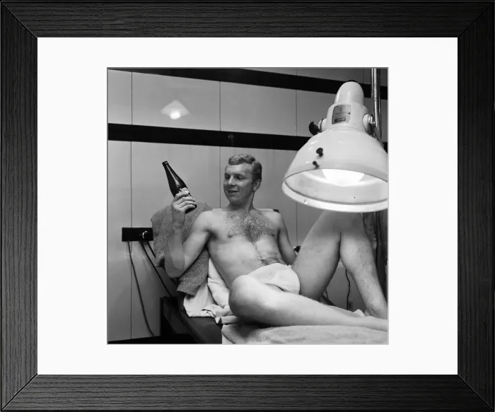 Framed Print : West Ham United captain Bobby Moore spending a few quiet minutes under the sun lamp with Framed Print : West Ham United captain Bobby Moore spending a few quiet minutes under the sun lamp with