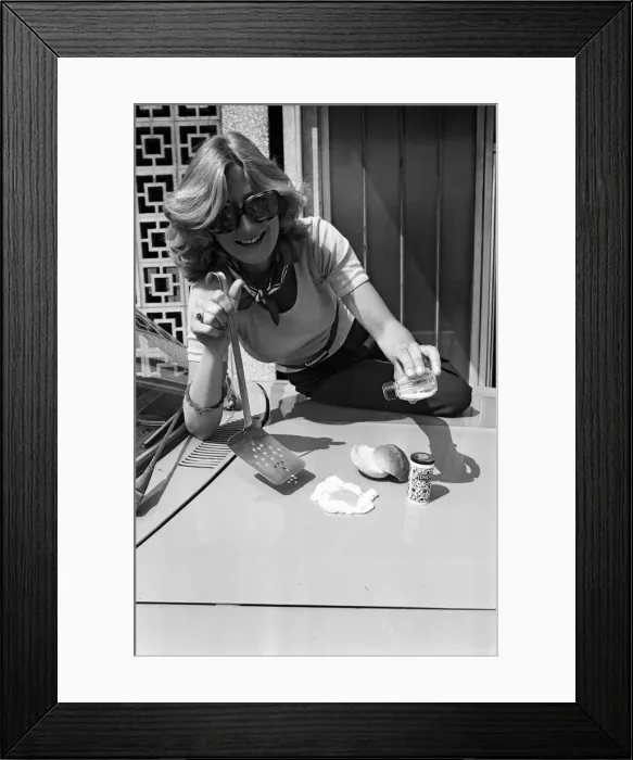 Framed Print : A woman cooks an egg on a car bonnet during the 1976 heatwave. 25th June 1976 Framed Print : A woman cooks an egg on a car bonnet during the 1976 heatwave. 25th June 1976