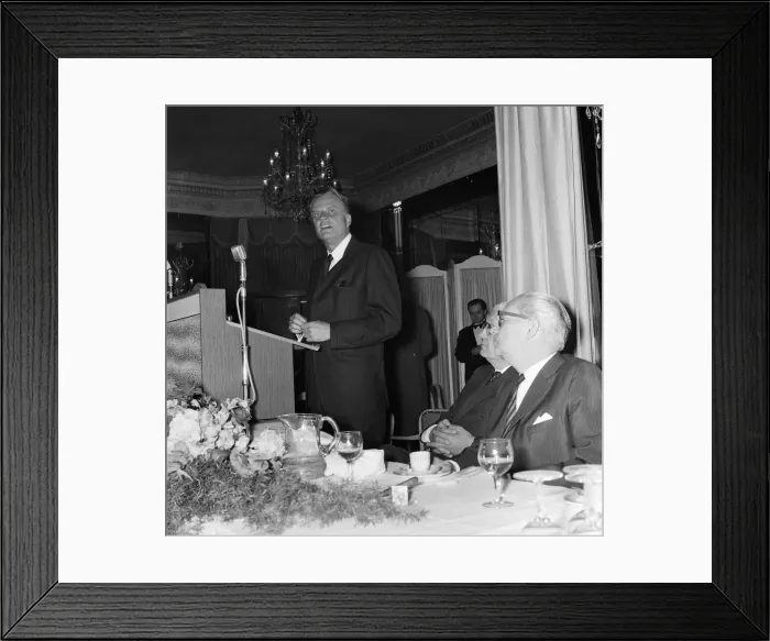 Framed Print : Billy Graham signs copies of his book World Aflame