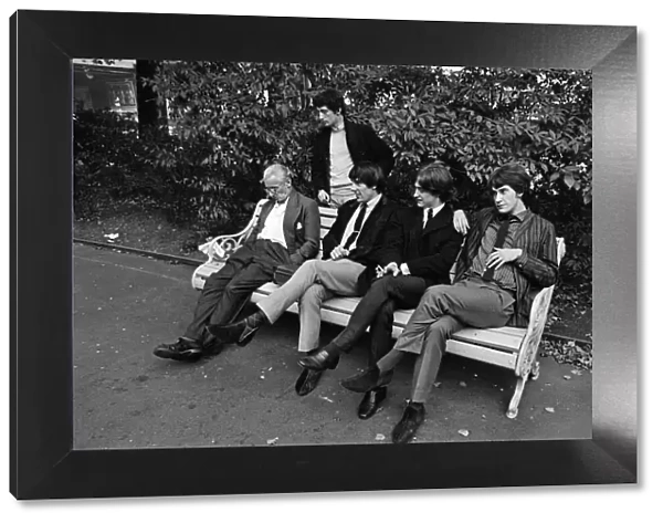 Members of the British pop group The Kinks posing in a London park