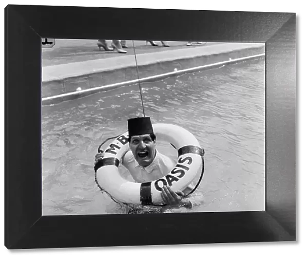 Tommy Cooper opening the Oasis outdoor swimming pool in Holborn for the season