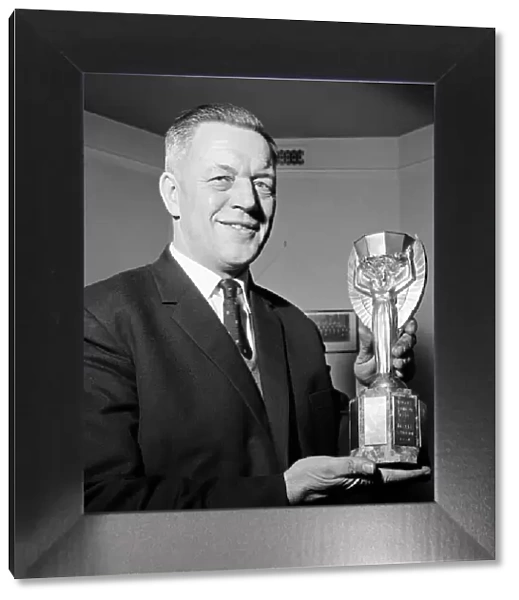 Chief Detective Inspector William Little holds the Jules Rimet World Cup trophy after it