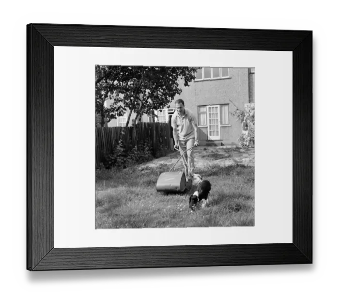 Framed Print : Fulham and England footballer George Cohen tries his hand at some household chores Framed Print : Fulham and England footballer George Cohen tries his hand at some household chores