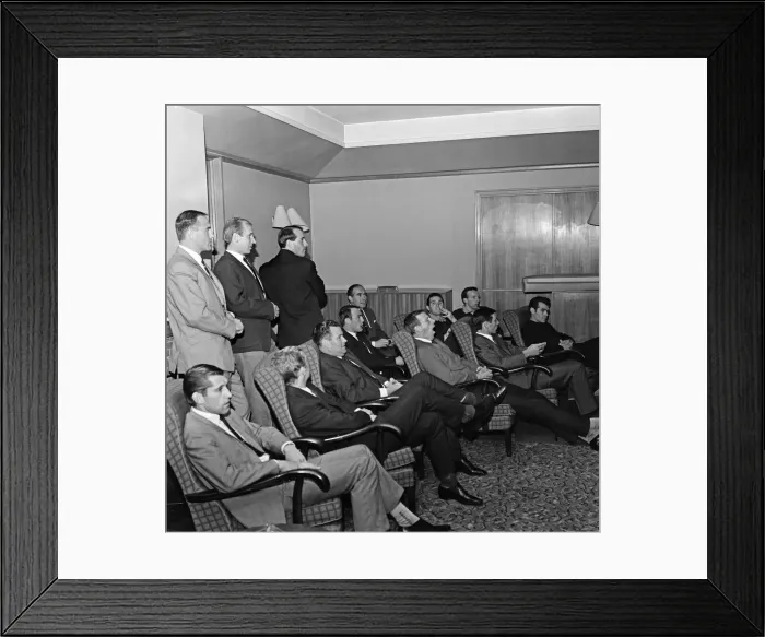 Framed Print : England team training session at Roehampton. The players sit to watch a film shot