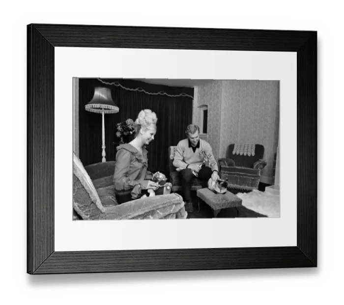 Framed Print : West Ham United and England footballer Bobby Moore pictured at home with his wife Tina Framed Print : West Ham United and England footballer Bobby Moore pictured at home with his wife Tina