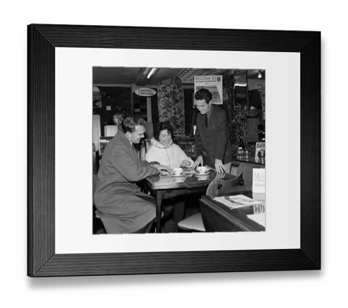Framed Print : Southampton and England footballer Terry Paine at work as a furniture salesman