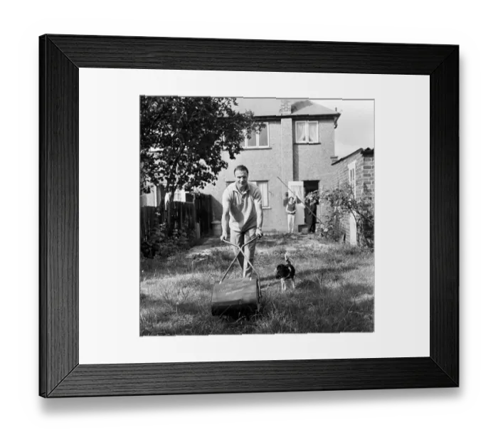 Framed Print : Fulham and England footballer George Cohen tries his hand at some household chores