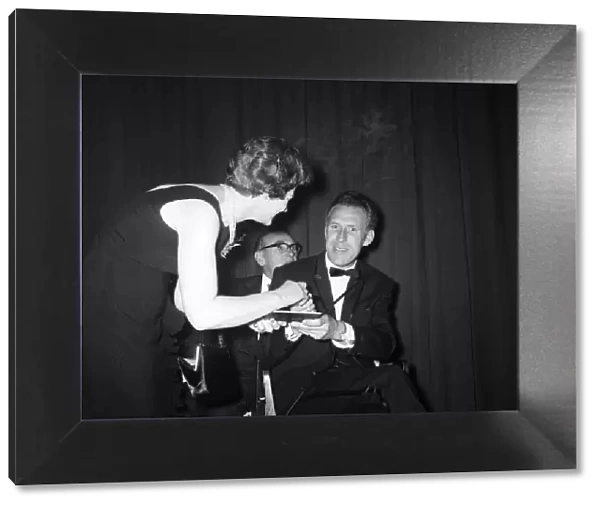 Bruce Forsyth signing an autograph at the Daily Mirror Television Award show