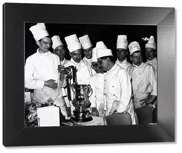 Chefs and Kitchen Staff admire the FC Cup at Villa Park