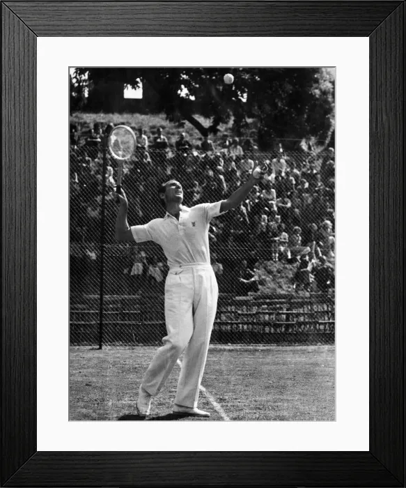 Framed Print : Fred Perry Tennis player demonstrates the service play during his exhibition at Cardiff Framed Print : Fred Perry Tennis player demonstrates the service play during his exhibition at Cardiff