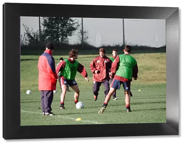 Manchester United in training. Roy Keane on the ball challenged by David Beckham