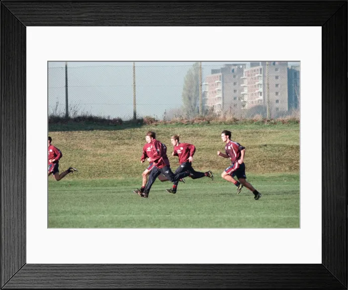 Framed Print : Manchester United in training. David Beckham running with Gary (hidden Framed Print : Manchester United in training. David Beckham running with Gary (hidden