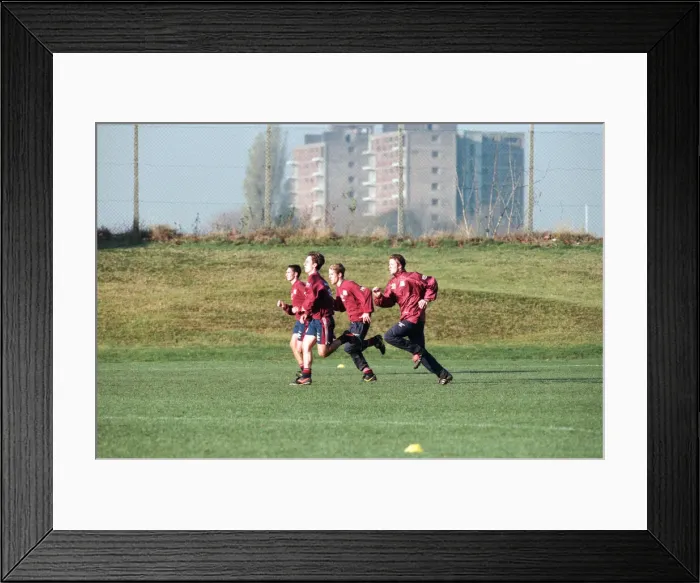 Framed Print : Manchester United in training. David Beckham running with Gary and Phil Neville