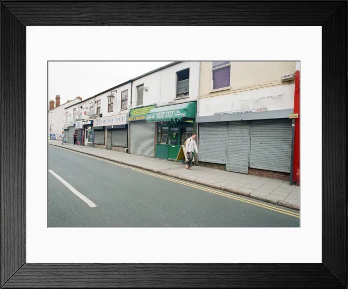 Framed Print : Examples of shuttered and non-shuttered shops on Far Gosford Street Framed Print : Examples of shuttered and non-shuttered shops on Far Gosford Street