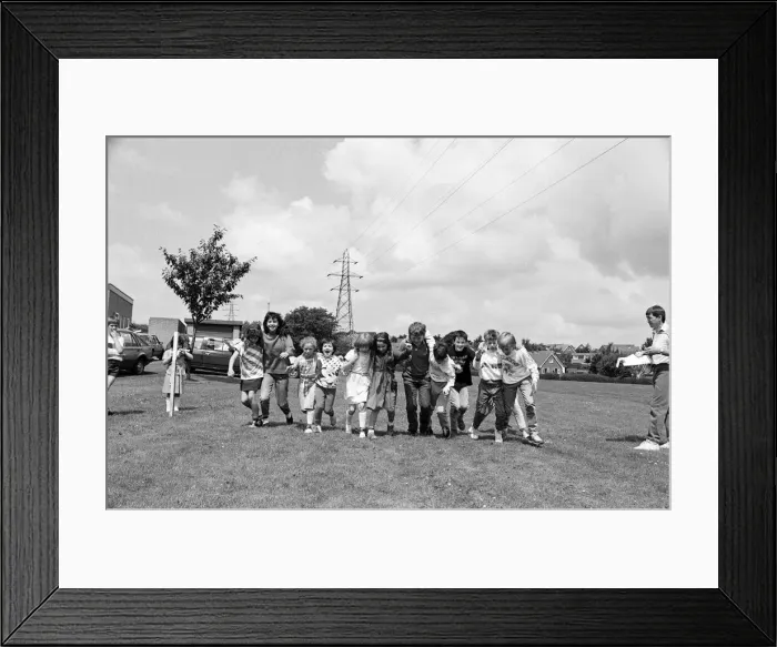 Framed Print : All fall down! Contestants in the three-legged race at Scissett C of E First School Framed Print : All fall down! Contestants in the three-legged race at Scissett C of E First School
