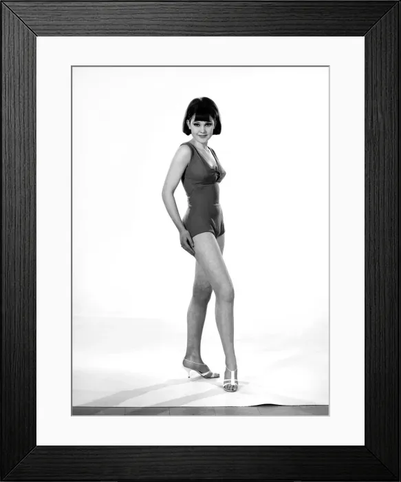 Framed Print : Model, Debbie Attwood, poses in the latest beachwear fashion, Studio Pix, 1963 Framed Print : Model, Debbie Attwood, poses in the latest beachwear fashion, Studio Pix, 1963