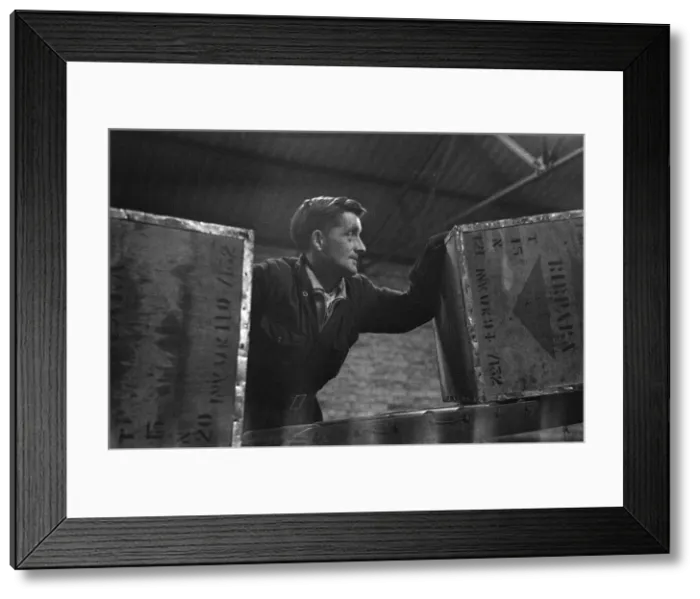 Framed Print : Some of the hundreds of chest of tea from all of the world being unloaded at the Ty-phoo Framed Print : Some of the hundreds of chest of tea from all of the world being unloaded at the Ty-phoo