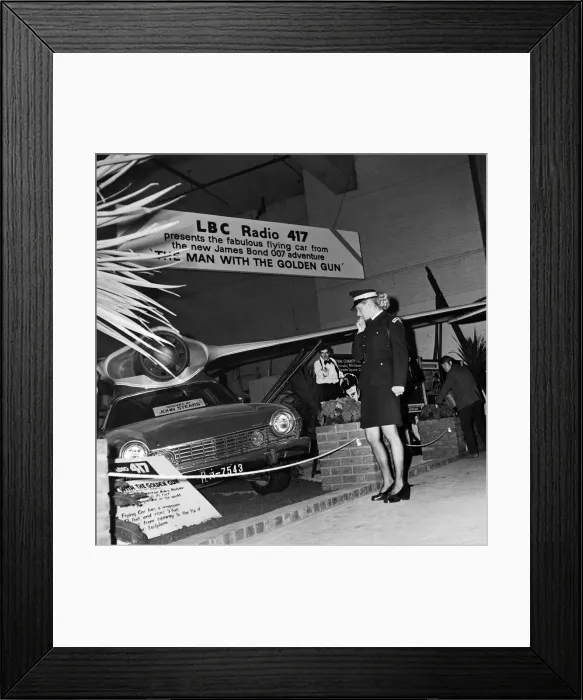 Framed Print : Motor Show Preview Day at Earls Court. Traffic Warden Jacqui Smith looks Framed Print : Motor Show Preview Day at Earls Court. Traffic Warden Jacqui Smith looks