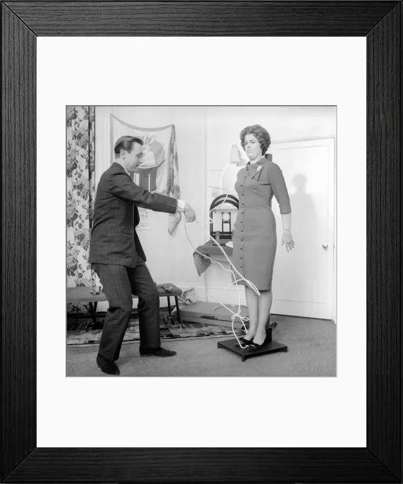 Framed Print : Magician Bernard Hughes performing rope trick with female assistant Framed Print : Magician Bernard Hughes performing rope trick with female assistant