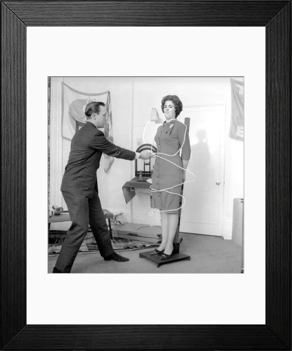 Framed Print : Magician Bernard Hughes performing rope trick with female assistant Framed Print : Magician Bernard Hughes performing rope trick with female assistant