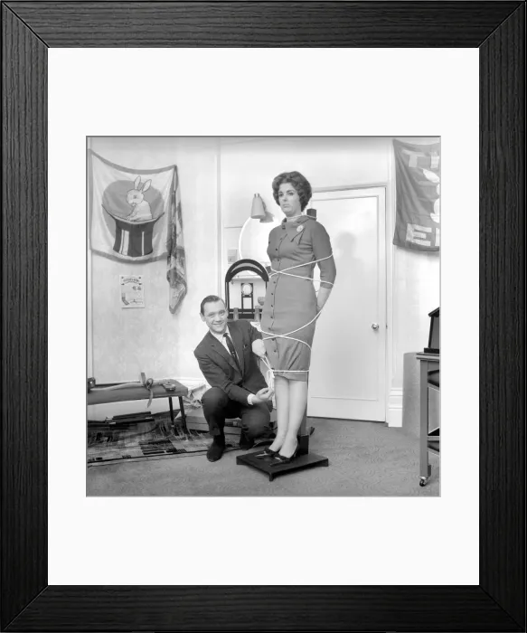 Framed Print : Magician Bernard Hughes performing rope trick with female assistant. April 1965 A1116b