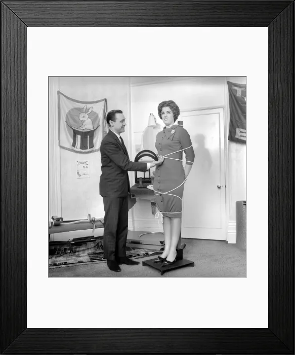 Framed Print : Magician Bernard Hughes performing rope trick with female assistant Framed Print : Magician Bernard Hughes performing rope trick with female assistant