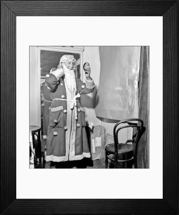 Framed Print : Christmas: Father Christmas seen here at Pontings. Santa is played by 88 year old Stanley Framed Print : Christmas: Father Christmas seen here at Pontings. Santa is played by 88 year old Stanley