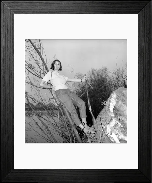Framed Print : Gwendolen Tulley poses with her rifle as she enjoys a shooting holiday, 1956 Framed Print : Gwendolen Tulley poses with her rifle as she enjoys a shooting holiday, 1956