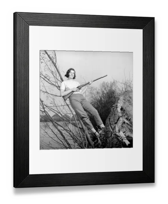 Framed Print : Gwendolen Tulley poses with her rifle as she enjoys a shooting holiday, 1956