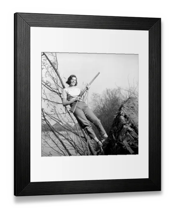 Framed Print : Gwendolen Tulley poses with her rifle as she enjoys a shooting holiday, 1956