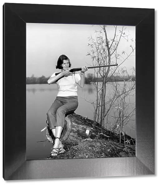 Gwendolen Tulley poses with her rifle as she enjoys a shooting holiday, 1956