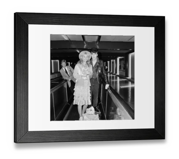 Framed Print : Britt Ekland with boyfriend Jim McDonnell, leaving Heathrow for Los Angeles Framed Print : Britt Ekland with boyfriend Jim McDonnell, leaving Heathrow for Los Angeles